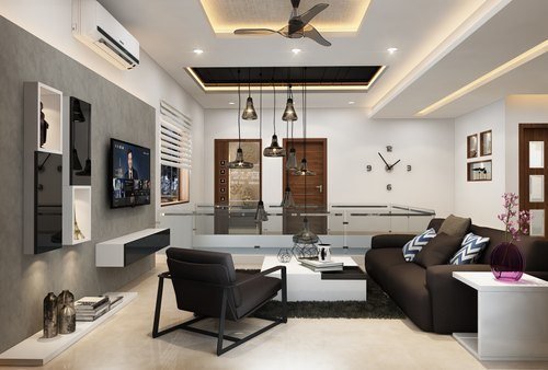 Living room with pendant lights and a layered ceiling