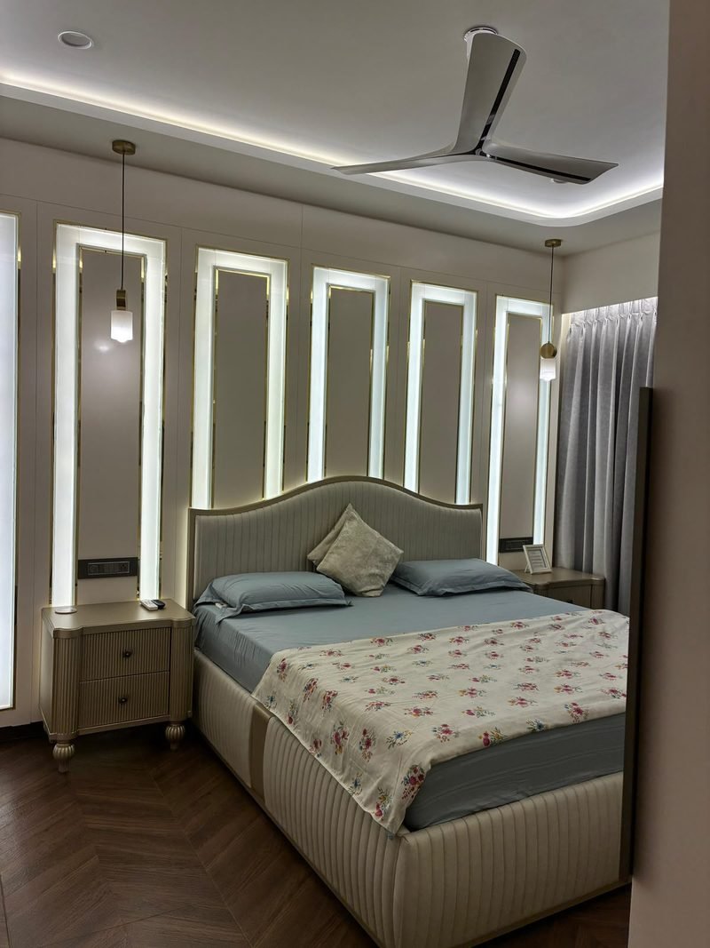 Bedroom with timber ceiling detail and a low platform bed